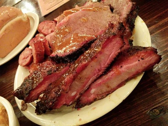 The Salt Lick BBQ signature dishes Brisket, Pork Ribs, Bison Ribs.